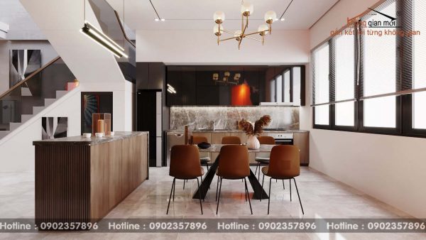 Phòng khách với phòng bếp được thiết kế liên thông tạo sự thông thoáng trong không gian nhà
